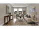 Bright and airy living room featuring plush seating, stylish decor, and plenty of natural light at 805 Switchyard Pl, Indianapolis, IN 46202