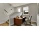 Bright office nook with wooden desk, comfortable chair, and window, perfect for working from home at 805 Switchyard Pl, Indianapolis, IN 46202