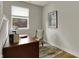 Cozy office space featuring a wooden desk, chair, and natural light from the window at 805 Switchyard Pl, Indianapolis, IN 46202