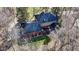 Aerial view of home featuring a brick patio, dark roof, outdoor seating, and lush green lawn at 8220 Traders Hollow Ct, Indianapolis, IN 46278