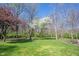Expansive backyard with mature trees, offering privacy and serenity at 8220 Traders Hollow Ct, Indianapolis, IN 46278