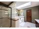 Stylish bathroom with a shower, a soaking tub, and a glass block divider for added privacy at 8220 Traders Hollow Ct, Indianapolis, IN 46278