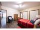 Comfortable bedroom with wood accents, plenty of storage, and patriotic décor at 8220 Traders Hollow Ct, Indianapolis, IN 46278