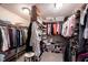 Walk-in closet with organized storage solutions, including shelves, baskets, and hanging rods at 8220 Traders Hollow Ct, Indianapolis, IN 46278