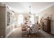 Inviting dining room with neutral tones, round table, and decorative hutch at 8220 Traders Hollow Ct, Indianapolis, IN 46278