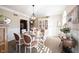 Bright dining room with round table, china cabinet, and elegant decor at 8220 Traders Hollow Ct, Indianapolis, IN 46278