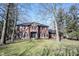 Stately two-story brick home featuring a well-manicured lawn and symmetrical design at 8220 Traders Hollow Ct, Indianapolis, IN 46278