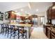 Kitchen with stainless steel appliances, granite countertops, eat-in breakfast bar and tile flooring at 8220 Traders Hollow Ct, Indianapolis, IN 46278