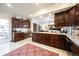 Open kitchen features a large center island with stainless steel appliances and ample cabinet space at 8220 Traders Hollow Ct, Indianapolis, IN 46278