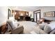 Cozy living room features a brick fireplace, wood paneling, and comfortable seating at 8220 Traders Hollow Ct, Indianapolis, IN 46278