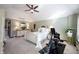 Bright main bedroom with an exercise machine, complemented by neutral tones and a ceiling fan at 8220 Traders Hollow Ct, Indianapolis, IN 46278