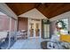 Sunroom with a vaulted ceiling and a view of the wooded backyard at 8220 Traders Hollow Ct, Indianapolis, IN 46278