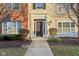 Inviting front entrance with a classic black door, decorative sidelights, and manicured shrubbery at 8233 Katrina Way, Fishers, IN 46038