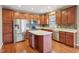 Spacious kitchen featuring stainless steel appliances, plentiful cabinetry, and stone backsplash at 8233 Katrina Way, Fishers, IN 46038