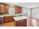Cozy kitchen with wood cabinets, modern countertops, and stainless steel dishwasher at 8233 Katrina Way, Fishers, IN 46038
