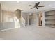 Inviting living area featuring a staircase, chandelier, and attractive built-in shelving at 8233 Katrina Way, Fishers, IN 46038