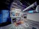 Basement workshop with pegboard storage area features ample lighting, a stool, and work surface at 850 N Butler Ave, Indianapolis, IN 46219