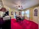 Spacious dining room featuring period furnishings, large windows and built-in hutch at 850 N Butler Ave, Indianapolis, IN 46219