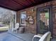 Inviting front porch featuring classic brickwork, seating, and decorative accents at 850 N Butler Ave, Indianapolis, IN 46219