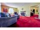 Cozy living room with a brick fireplace, archways and colorful decor at 850 N Butler Ave, Indianapolis, IN 46219