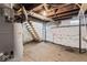 The unfinished basement features concrete floors and exposed utilities at 866 W 29Th St, Indianapolis, IN 46208