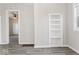Bedroom with neutral walls, hardwood floors, and a built-in shelving at 866 W 29Th St, Indianapolis, IN 46208