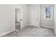 This bedroom features neutral walls, plush carpeting, one window, and a closet at 866 W 29Th St, Indianapolis, IN 46208