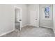 Bedroom featuring carpeted floors and a view to the hallway at 866 W 29Th St, Indianapolis, IN 46208