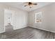 A cozy bedroom with wood-look flooring and natural light, complemented by neutral wall colors and stylish fixtures at 866 W 29Th St, Indianapolis, IN 46208