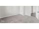 This bedroom features neutral walls and plush carpeting and an open doorway to another room at 866 W 29Th St, Indianapolis, IN 46208