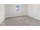 This bedroom features neutral walls and plush carpeting and ample natural light from one window at 866 W 29Th St, Indianapolis, IN 46208