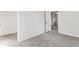 Spacious bedroom features neutral walls and carpeting and an open doorway to another room at 866 W 29Th St, Indianapolis, IN 46208