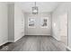 Inviting dining room with modern floors and bright lighting, enhanced by built-in shelving and large windows at 866 W 29Th St, Indianapolis, IN 46208