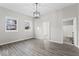 Inviting dining room with modern floors and bright lighting, enhanced by built-in shelving and large windows at 866 W 29Th St, Indianapolis, IN 46208