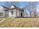 Charming home featuring a covered porch, updated siding and black trim accents at 866 W 29Th St, Indianapolis, IN 46208