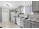 Modern kitchen featuring gray cabinets, white appliances, and stylish gray countertops at 866 W 29Th St, Indianapolis, IN 46208