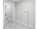 Bright laundry room features a laundry sink and sleek marble-patterned tile flooring at 866 W 29Th St, Indianapolis, IN 46208