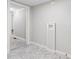 This laundry room features tile floors and connections for a washer and dryer at 866 W 29Th St, Indianapolis, IN 46208