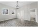 Spacious living room with hardwood floors and natural light from the two windows at 866 W 29Th St, Indianapolis, IN 46208