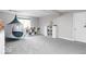 Finished basement with gray carpet, hanging tent, neutral paint, and closet organizer at 1040 Arthur Ct, Greenfield, IN 46140