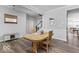Inviting dining area with wood-look floors, wainscoting, and an open view to the staircase and living spaces at 1040 Arthur Ct, Greenfield, IN 46140