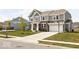 Attractive two-story home with gray siding, brick accents, a two-car garage, and a driveway with a basketball hoop at 1040 Arthur Ct, Greenfield, IN 46140