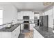 Well-equipped kitchen with stainless steel appliances, granite countertops, and ample storage at 1040 Arthur Ct, Greenfield, IN 46140