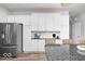 Bright kitchen featuring stainless appliances, granite countertops, island and white cabinetry at 1040 Arthur Ct, Greenfield, IN 46140