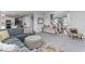 Comfortable living area showcasing a plush sofa, soft carpeting, and stylish decor at 1040 Arthur Ct, Greenfield, IN 46140