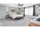 Spacious main bedroom with calming color palette, complemented by decor and large windows at 1040 Arthur Ct, Greenfield, IN 46140