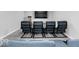 Theater room featuring a large screen TV, multiple blue upholstered chairs, and a popcorn machine at 1040 Arthur Ct, Greenfield, IN 46140