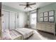 Well-lit ' bedroom with a soft color scheme, decorative wall art, and light wooden furniture at 1041 S State Ave, Indianapolis, IN 46203