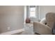 Calm Bedroom featuring a cozy chair, accent rug, and soft lighting for relaxing moments at 1041 S State Ave, Indianapolis, IN 46203