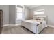 Neutral bedroom featuring a white bed frame with a truck pillow and carpeted floors at 1041 S State Ave, Indianapolis, IN 46203